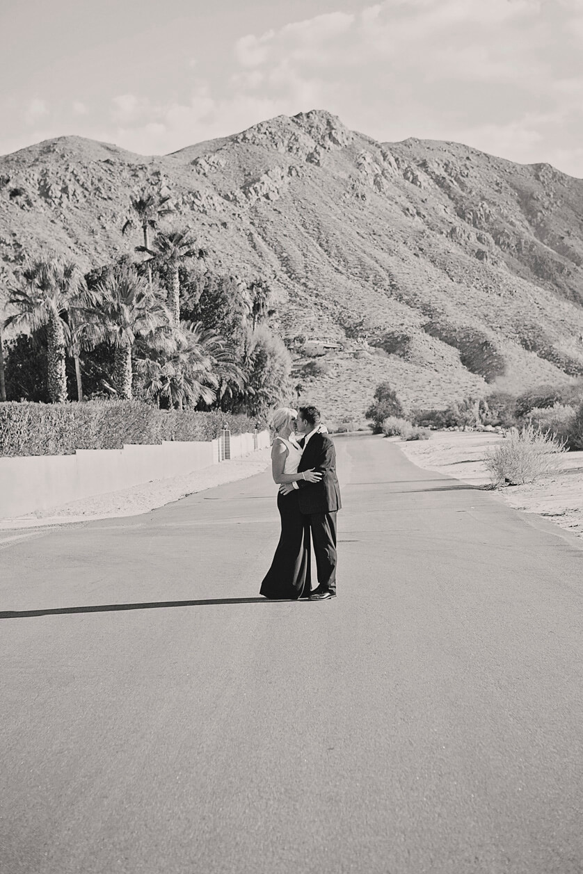 Fine art wedding photography Palm Springs California. Classic portrait in Black and White against start desert mountains