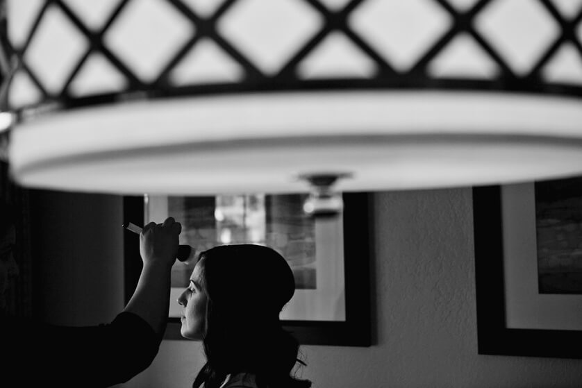 Wedding photograph Bride getting hair and makeup Black and white artistic