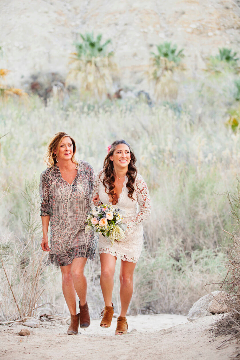Bride is walked down the aisle by her mom a this elopement