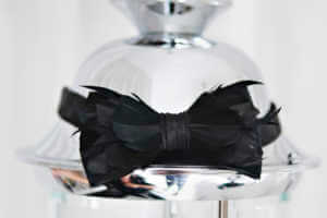 The grooms bowtie made out of feathers