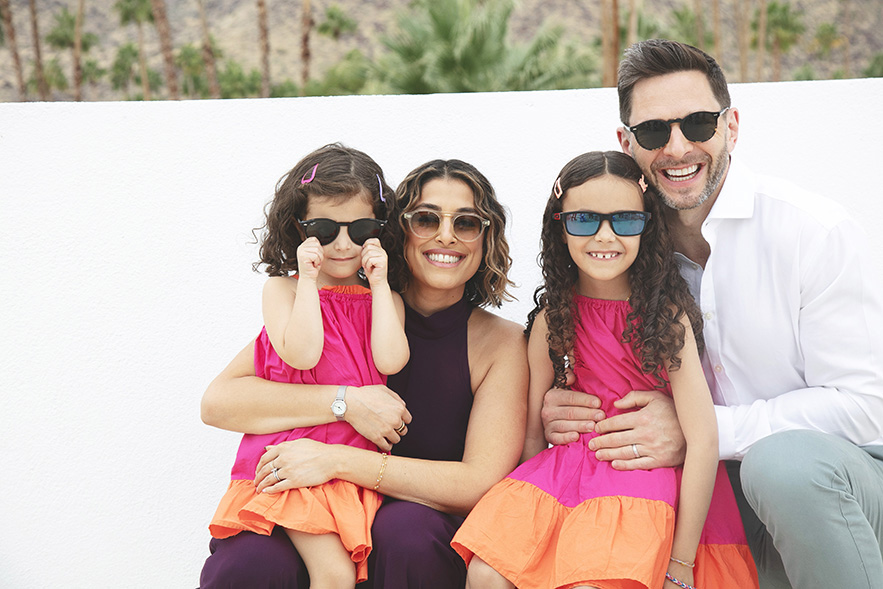 Auntie and Uncle with nieces play it cool in sunglasses for this casual portrait