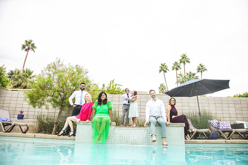 The entire extended family gather around the pool in Palm Springs for casual photo