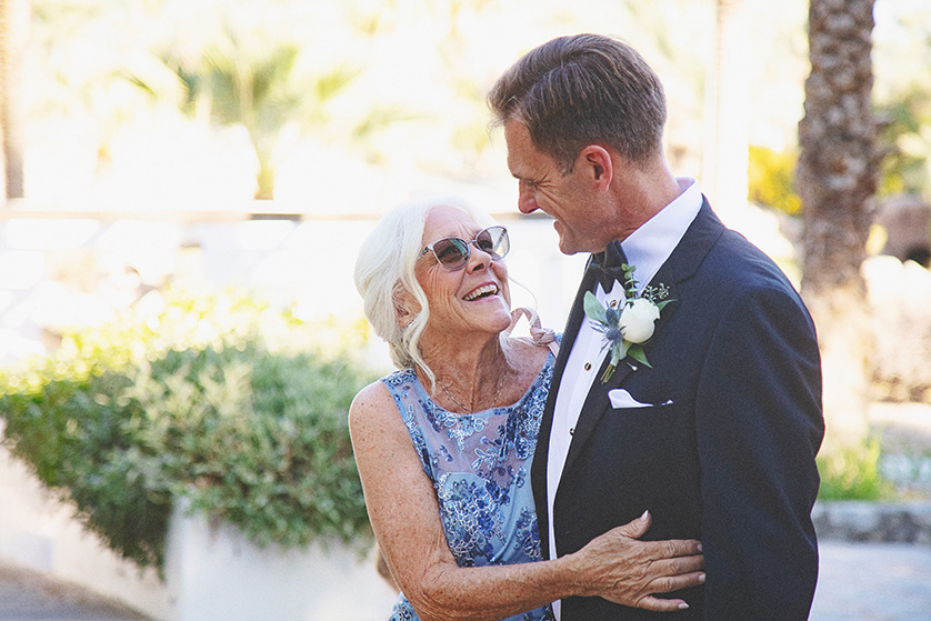 The groom gets a lovely hug from his mother