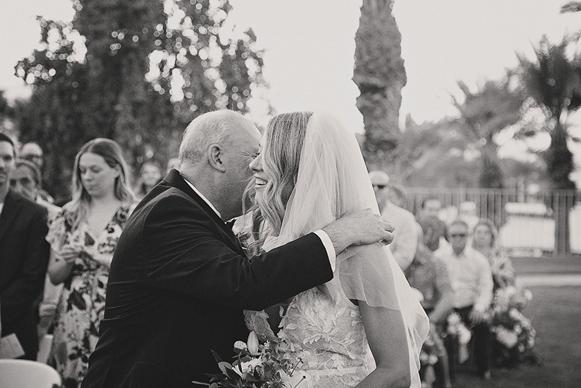 Brides dad gives her away at the alter