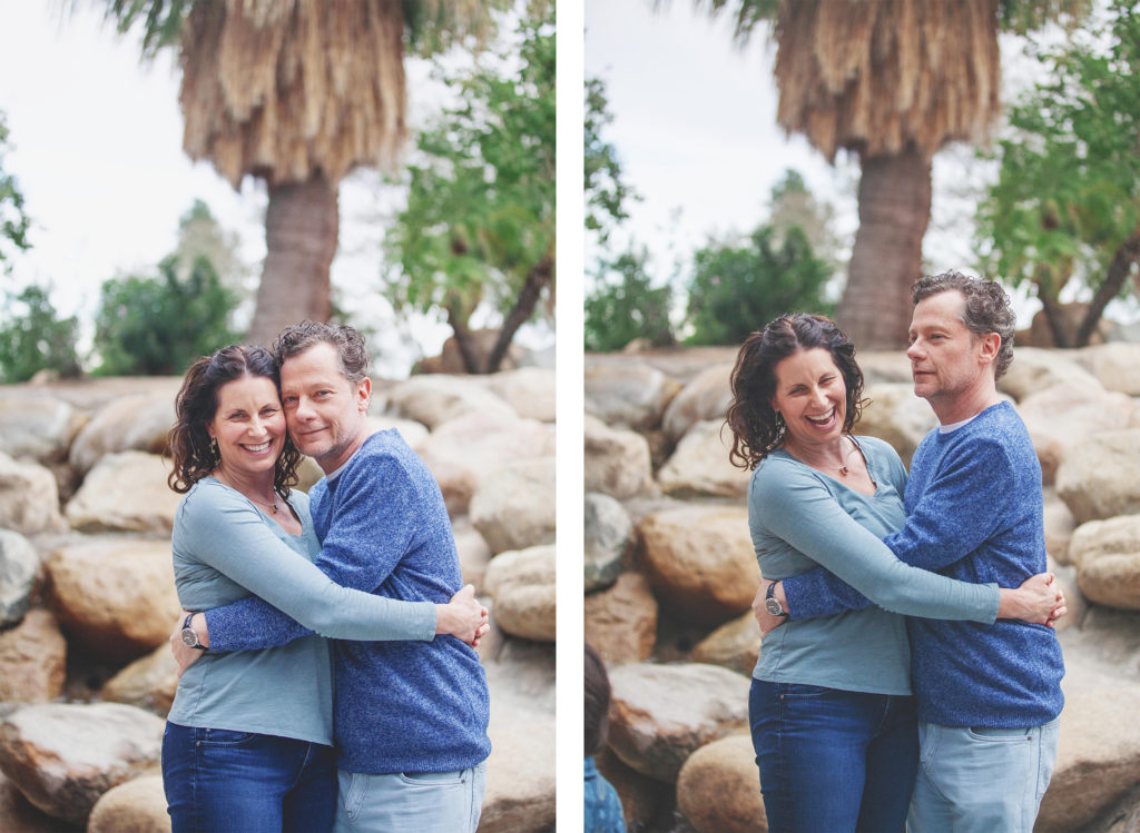 Husband and wife pose for relaxed and silly portraits in front of a fountain.