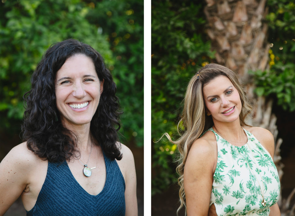 Two beautiful sister pose for individual portaits against neutral greenery