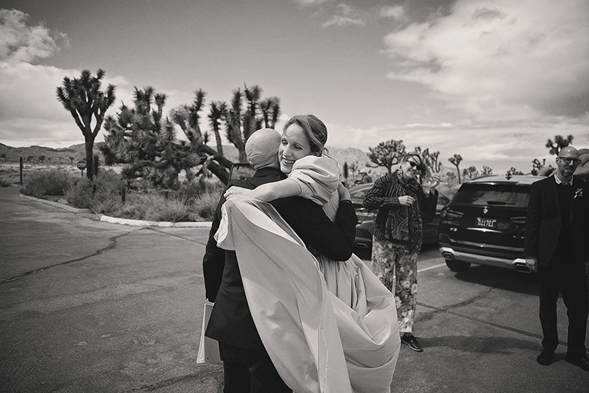 A candid moment between the bride and a dear friend