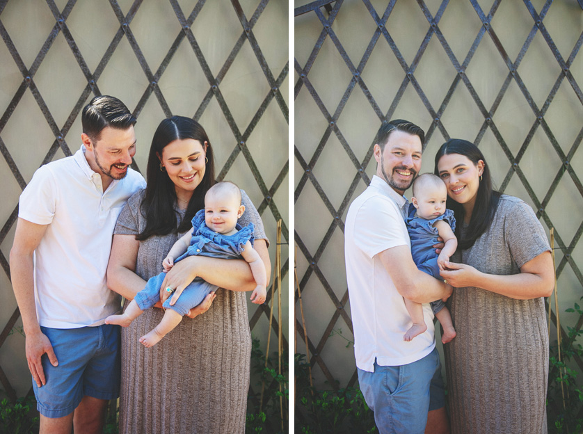 Mom, Dad and baby pose for sweet photos in front of a garden trellis