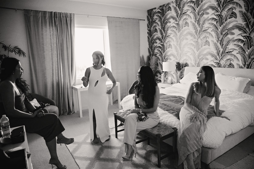 Bride hanging out with her friends in her suite