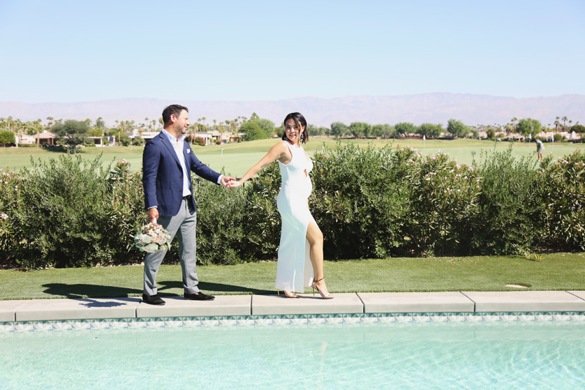 Stylish bride and groom photo by the pool