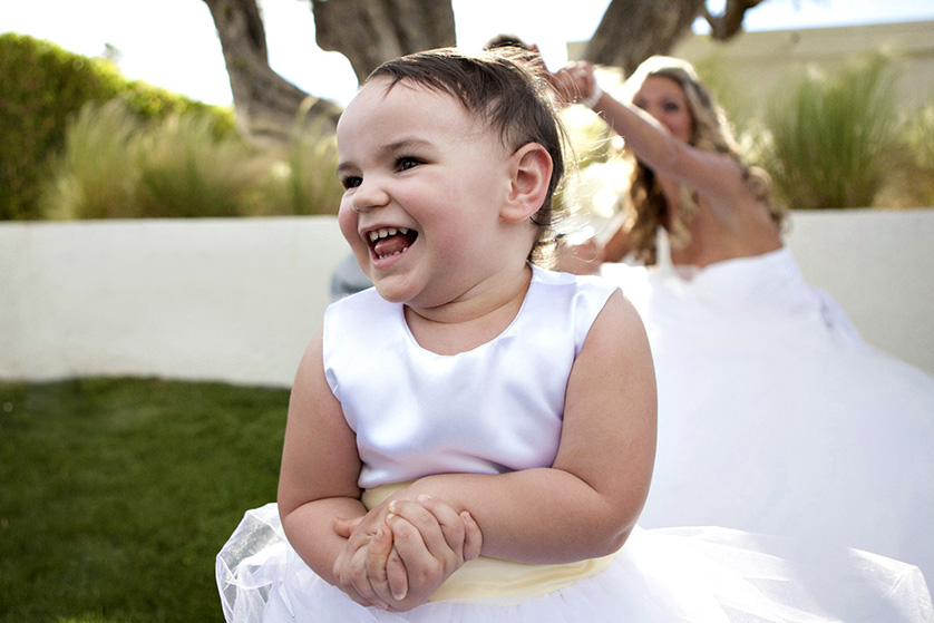 Toddler photo bombs wedding photos