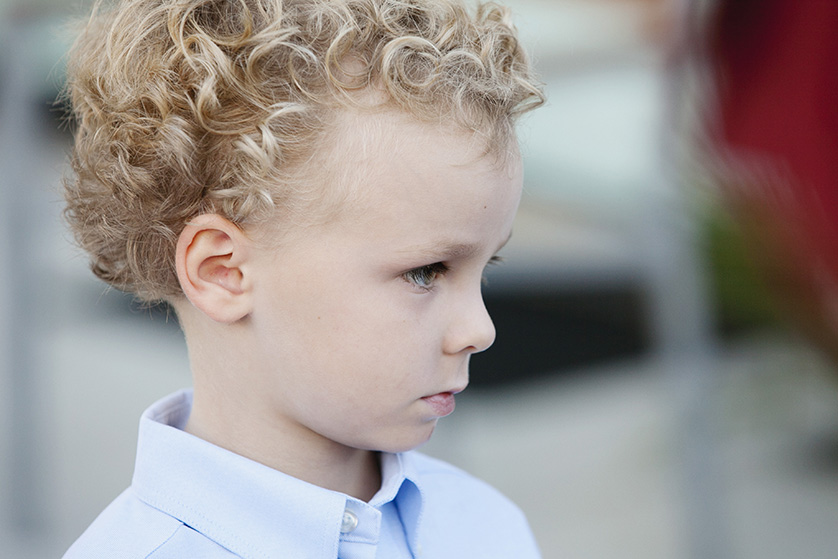 Image of a young boy with blonde curly hair