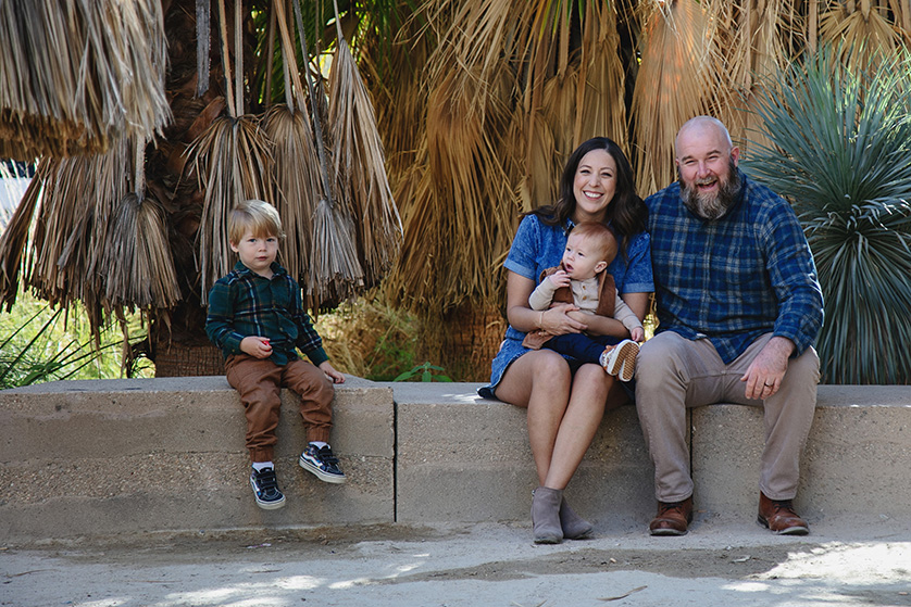 Toddler sits apart from family