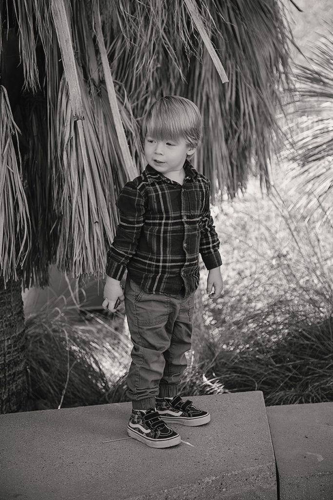 Candid photo of a toddler, in black and white