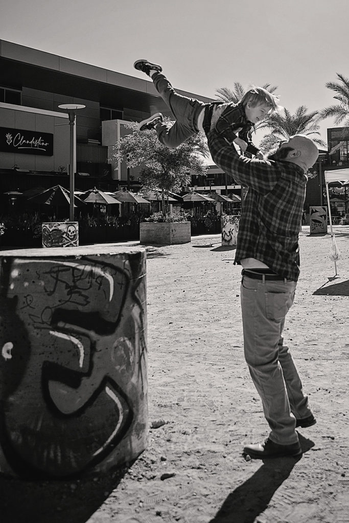 Black and white photo of dad and his toddler son