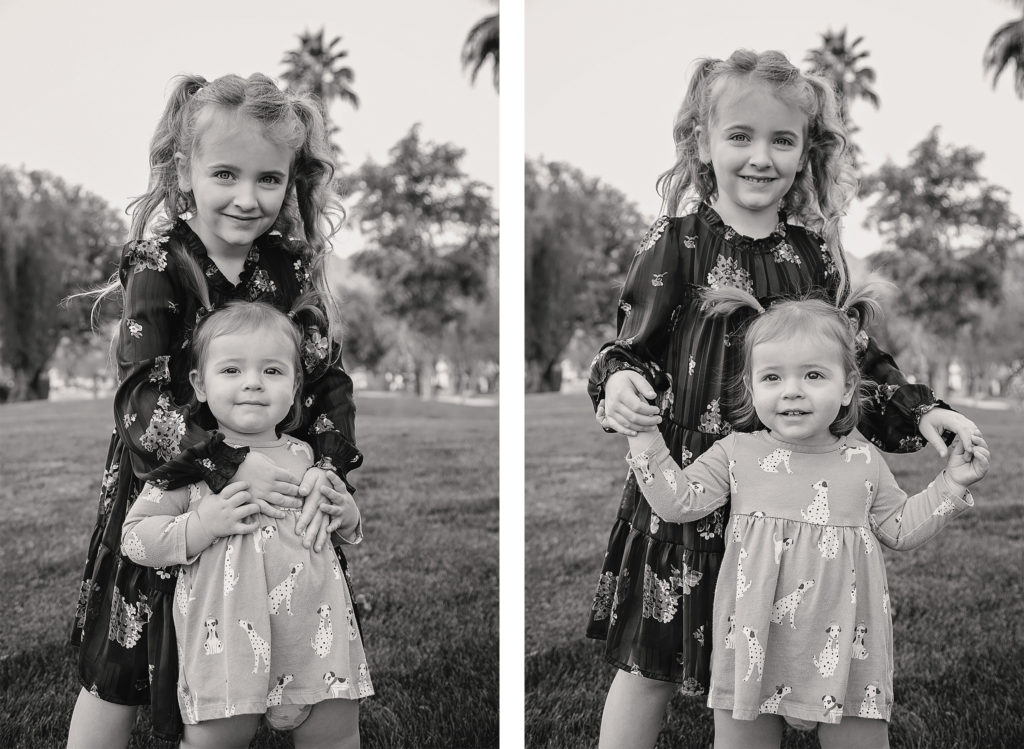 Young girl and her toddler sister pose for photos in black and white