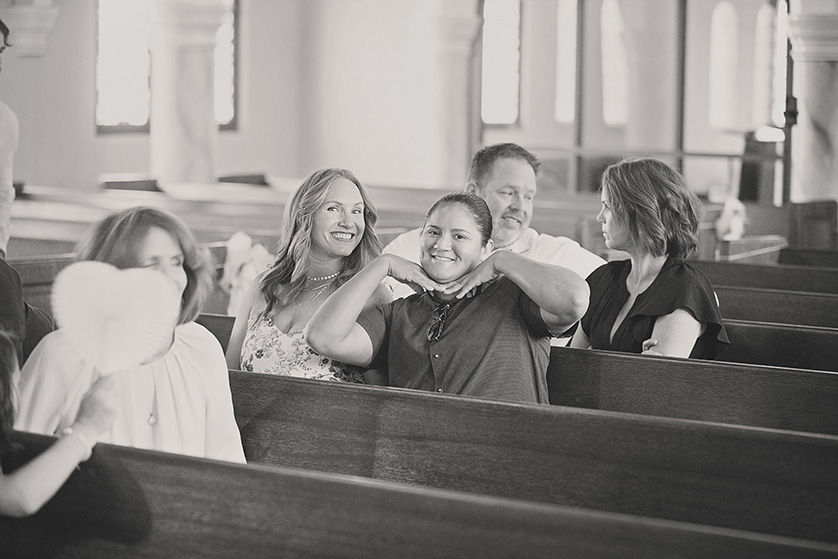 Guests being silly in the pews of a church