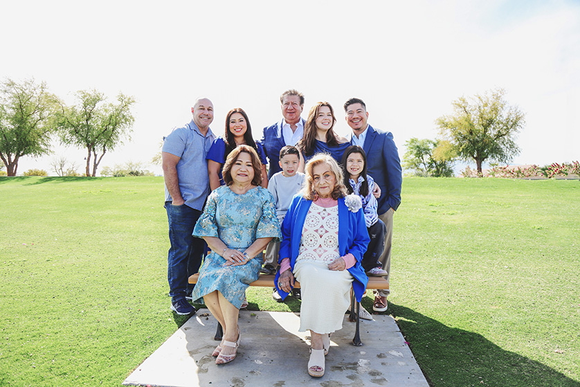 Group of nine family photo on park bench