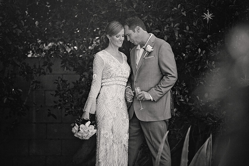 Bride and groom share a quiet moment together after their Palm Springs backyard ceremony.