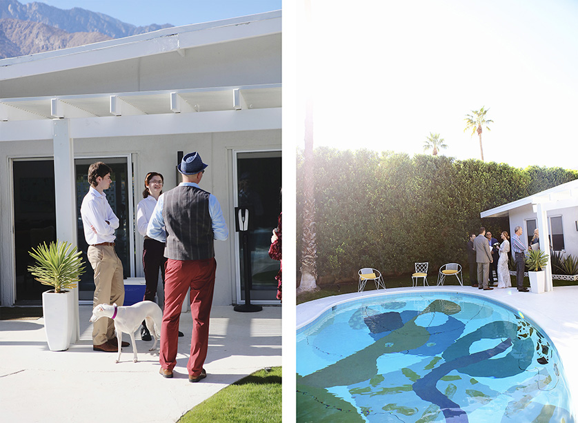 Wedding guests and the couple mingle outside a mid-century Palm Springs home near a painted pool, with their dog nearby.