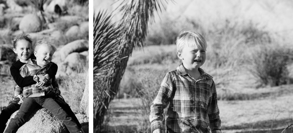 Two young children laughing together on a rock in the desert, and a crying boy standing alone, all in a natural desert landscape near Joshua Tree.