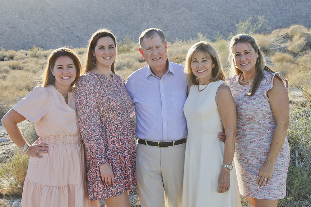 Desert family portraits with a mix of playful and posed moments — capturing genuine smiles and connections against the rugged Palm Springs mountains.