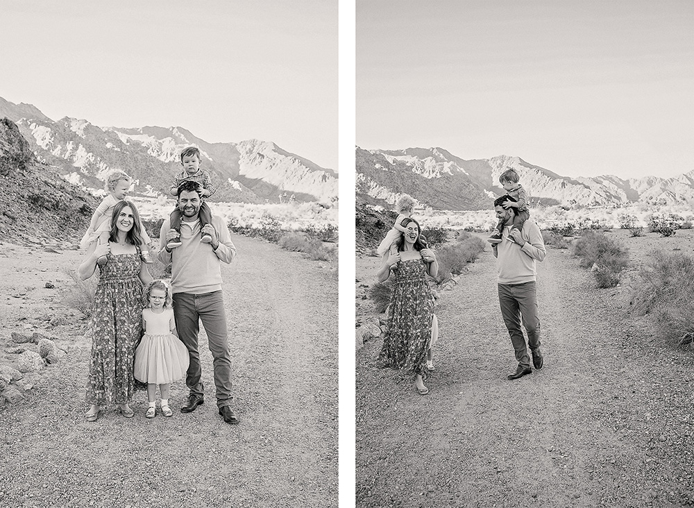 Image 1 (left)

“Black and white family portrait of parents and their three young children standing on a desert trail in La Quinta, California. The father and mother each carry a child on their shoulders while another child stands between them, with dramatic mountains in the background.”

Image 2 (right)

“Black and white candid photo of a family walking along a desert path in La Quinta, California. The father carries a child on his shoulders while the mother walks beside him with another child riding on her shoulders, set against rugged mountain scenery.”