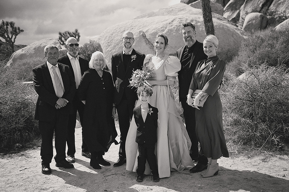 Family portrait after an intimate wedding ceremony at Joshua Tree National Park, captured in black and white documentary wedding photography