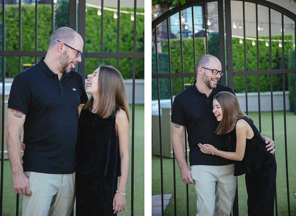 A sweet moment between a dad and his daughter, they make funny faces at each other then laugh