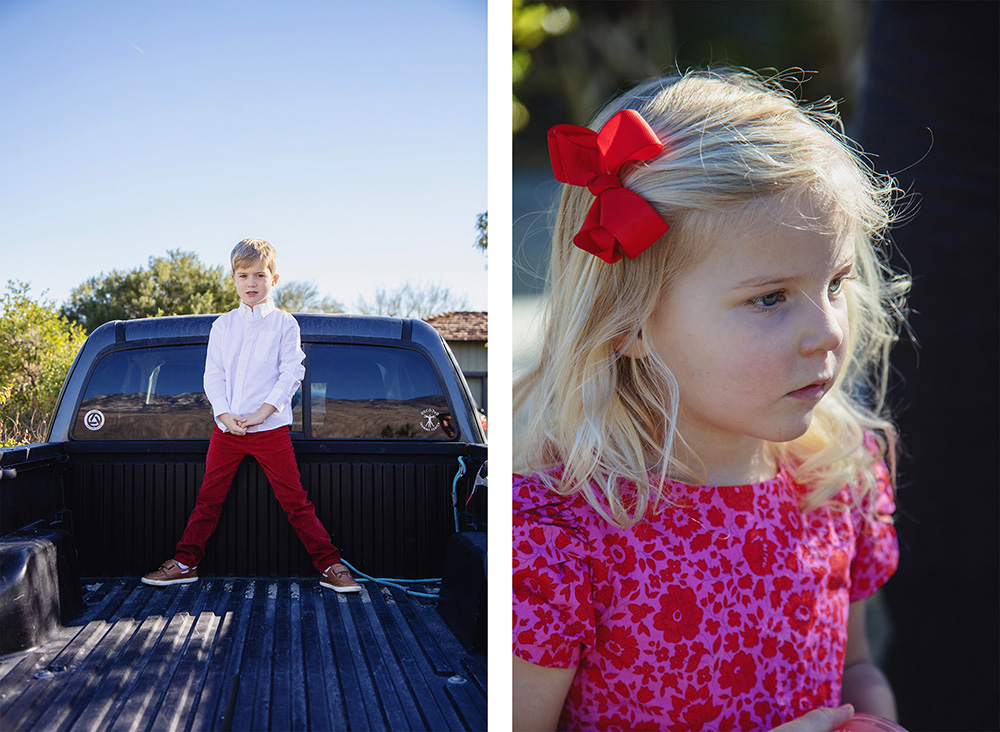 Young boy standing confidently in the back of a pickup truck and a close-up portrait of a young girl with a red bow during a Palm Springs family photography session.