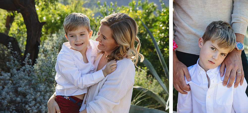Mother holding her young son outdoors during a candid Palm Springs family photography session, capturing a quiet, emotional moment between them.