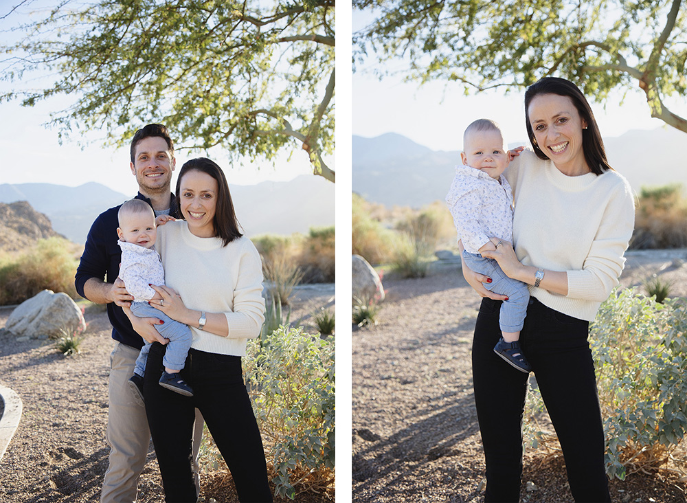 Parents standing together with their baby during a La Quinta Cove family photo session, smiling beneath desert trees with mountains in the background.
Mother holding her baby during a La Quinta Cove family photo session, smiling in soft desert light with mountain views behind her.
