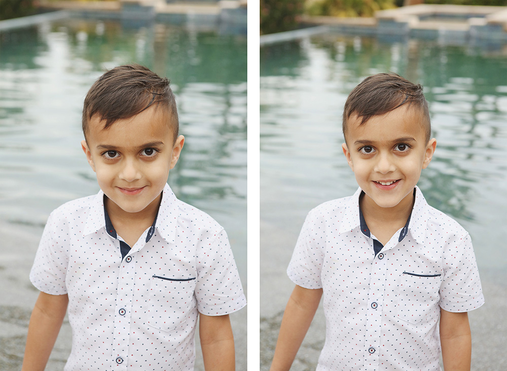 A young boy with brown hair and eyes, wearing a white short sleeved shirt smiles at the camera