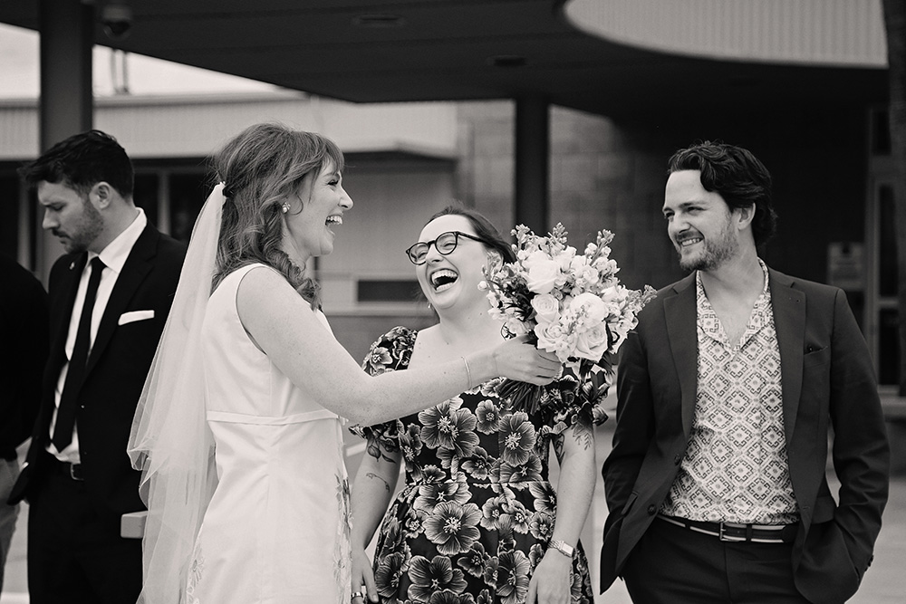 Bride shares a funny moment with her guests