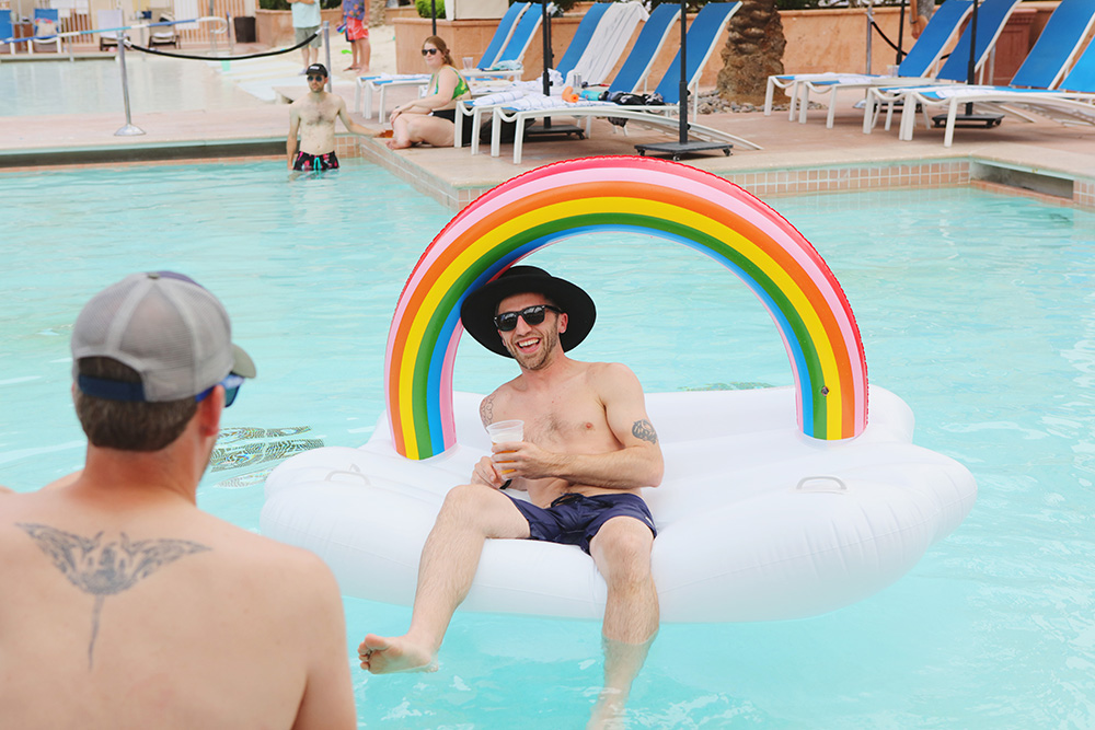 Fun pool float looks like a cloud with a rainbow. 