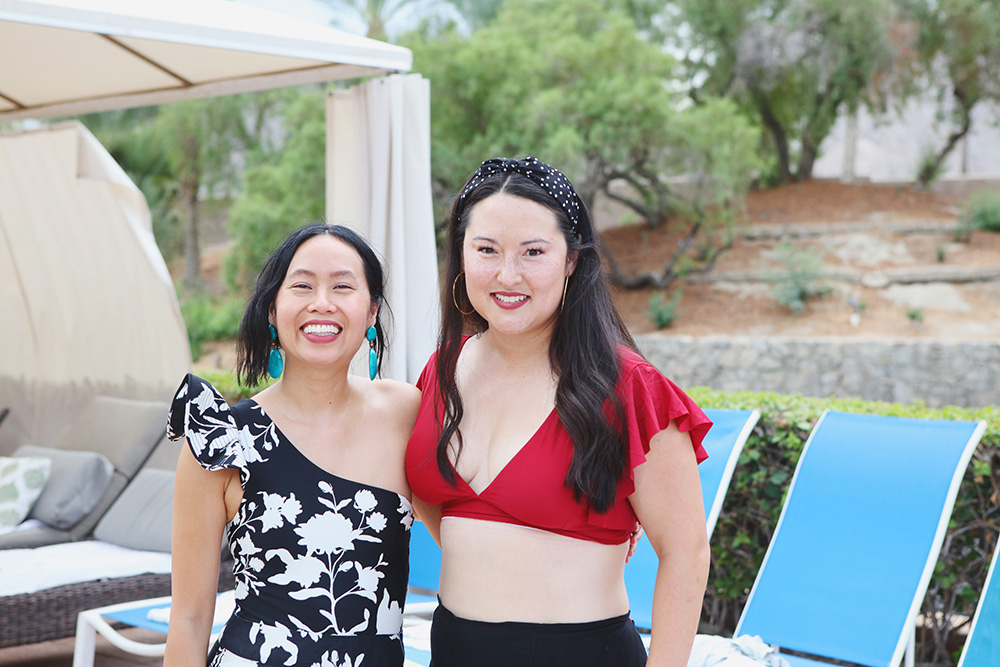 Two lovely ladies in their swim suits pose for a candid snap