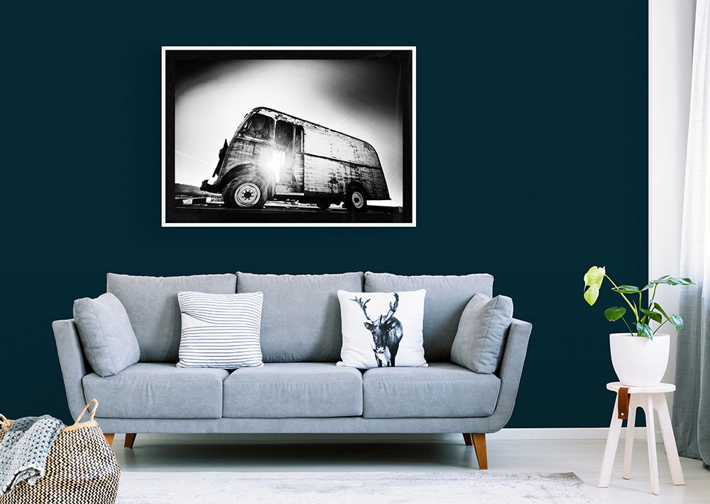 A striking black and white photograph of an vintage van.