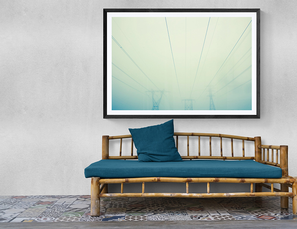 Monochromatic photo of powerlines in deep fog