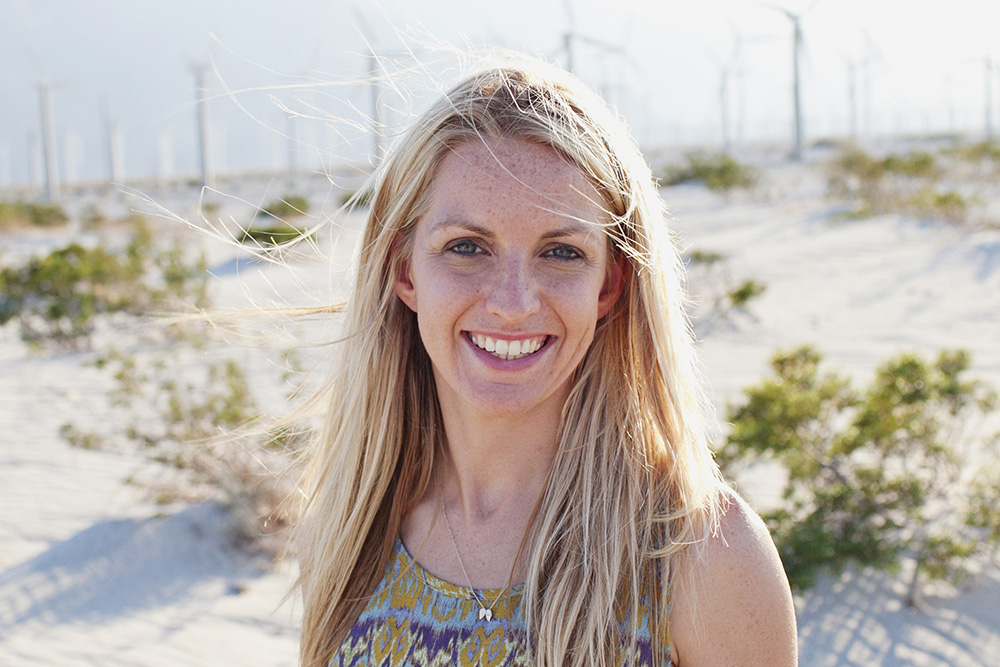 Portrait of a blond women smiling brightly at the camera