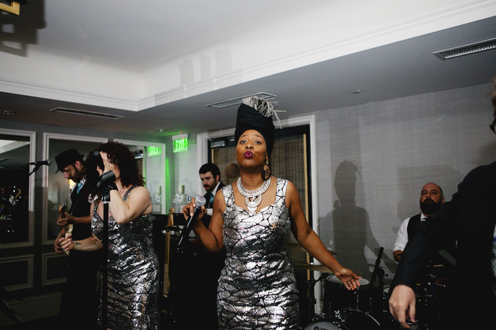 Beautiful singer in the band blows a kiss at the camera