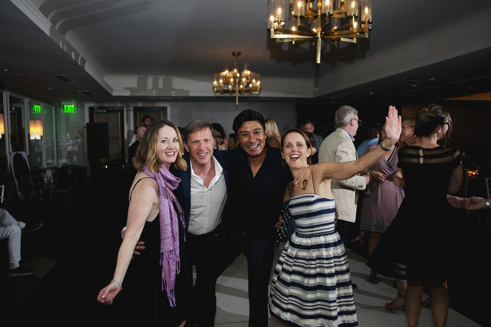 Four happy guests hamming it up for the camera