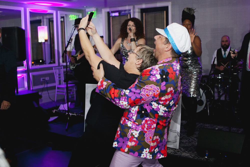 Birthday boy takes a selfie with one of his guests