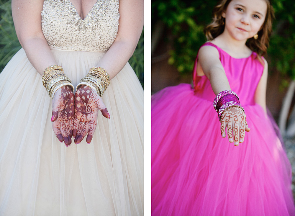 Bride and flower girl show off henna decorated hands