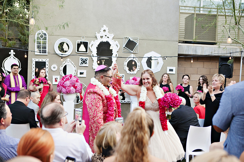 Bride and groom celebrate as they walk back down the aisle