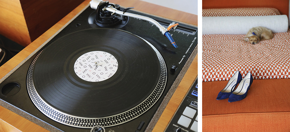 Image of a vintage record player and blue suede shoes sitting on an orange blanket