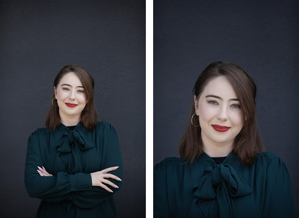 A woman in a green top and red lipstick posing for portraits